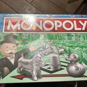 Monopoly Hasbro Gaming Updated Tokens. Brand new game with plastic wrap intact.
